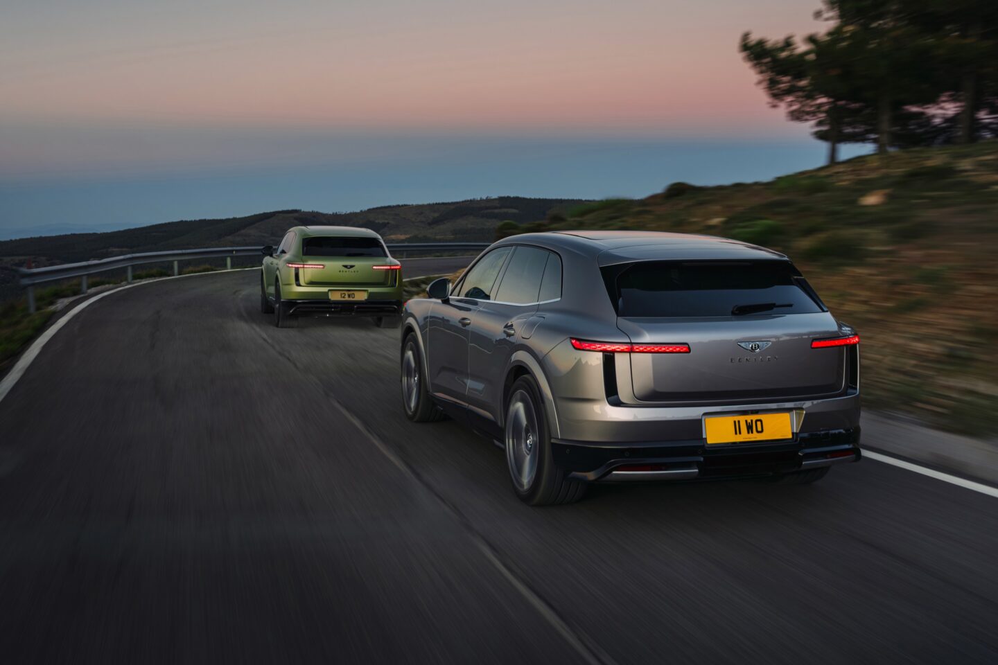 Two Bentley Torcals drive away from the camera